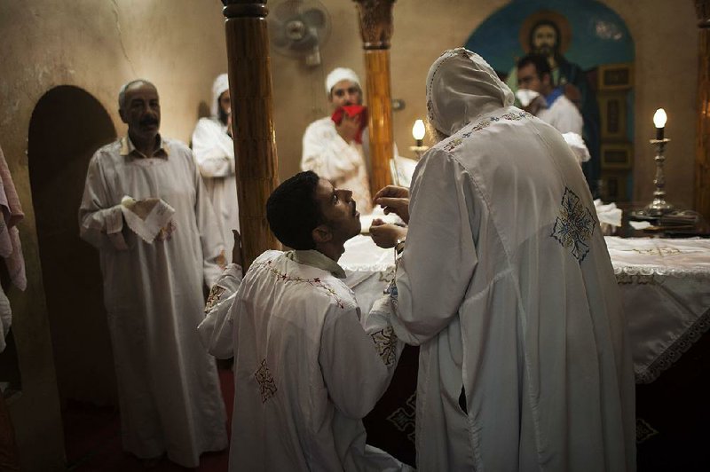 Coptic Christian receiving communion